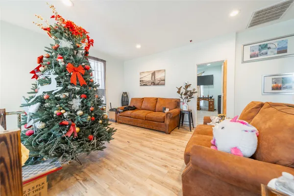 a living room filled with furniture and flowers