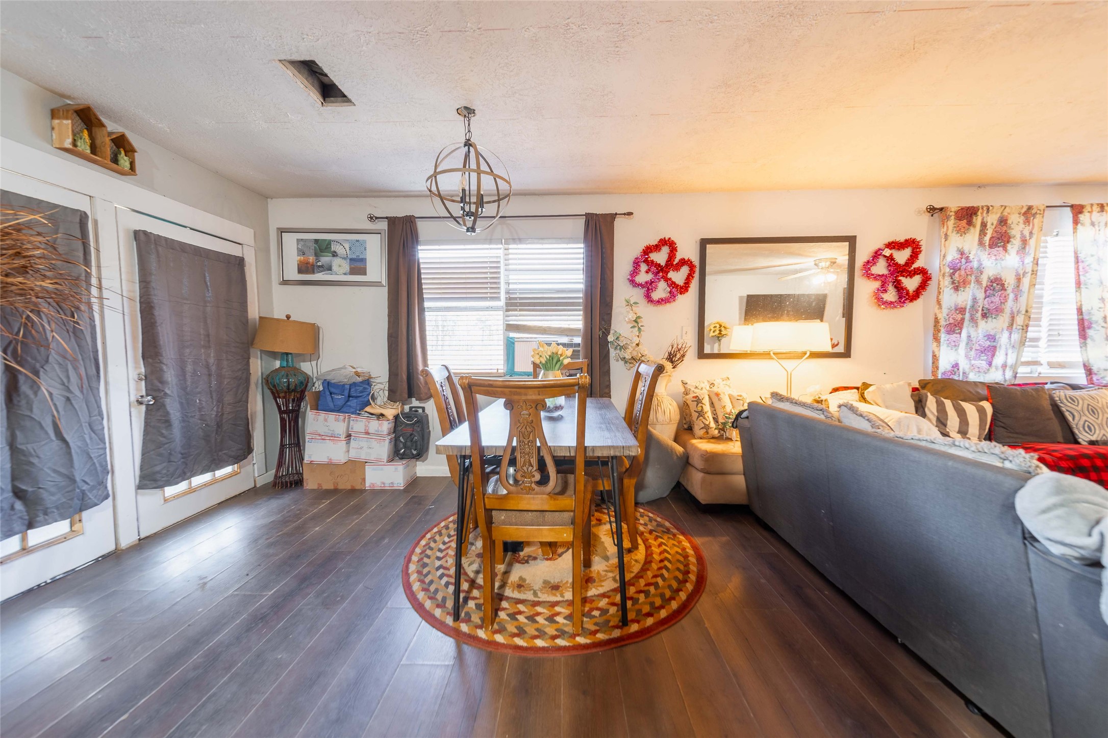 11 Seth Cleveland, TX 77328 - Photo 23 of 50 a living room with furniture and a chandelier