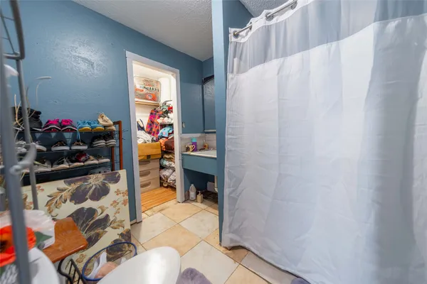 a bathroom with a sink vanity mirror and toilet