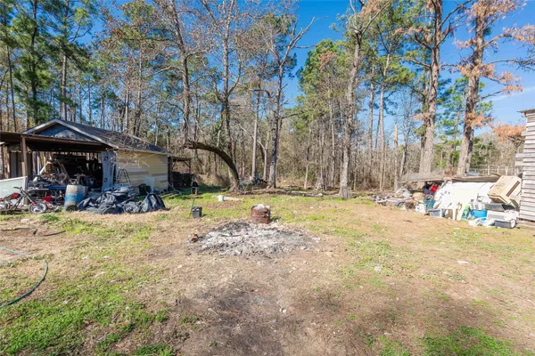 a view of yard with patio