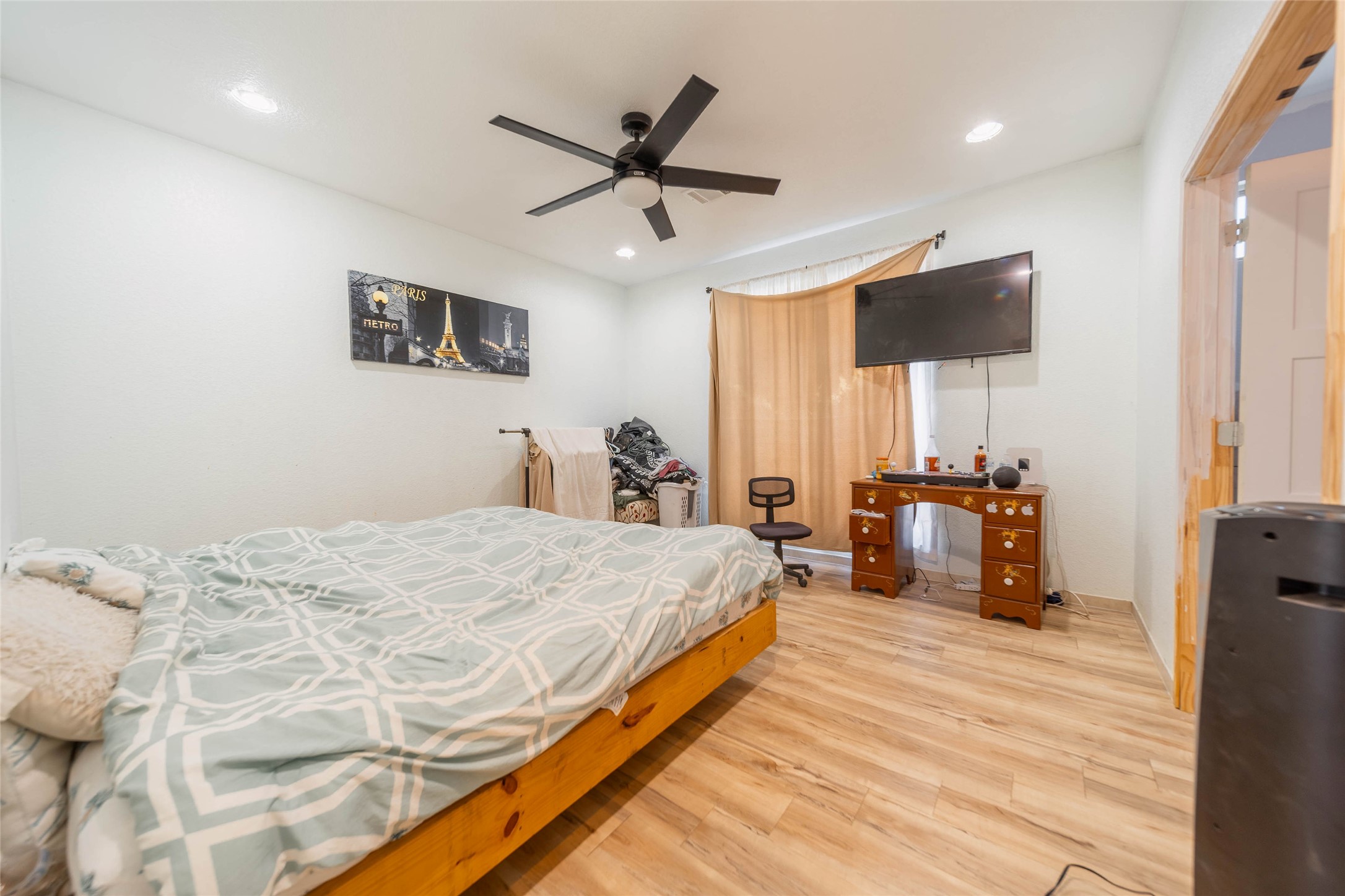 11 Seth Cleveland, TX 77328 - Photo 5 of 50 a bed room with a bed and a chandelier