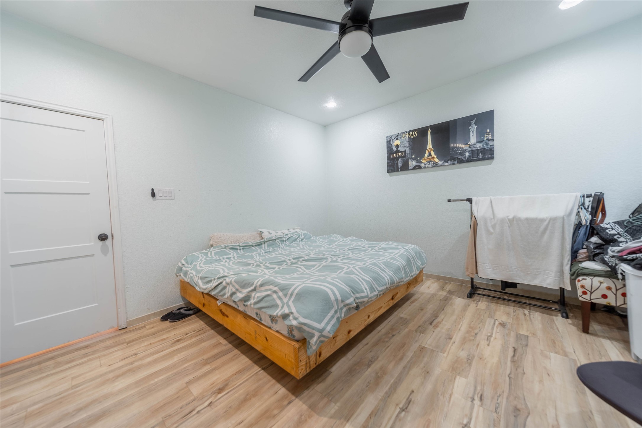 11 Seth Cleveland, TX 77328 - Photo 6 of 50 a bedroom with a bed and wooden floor