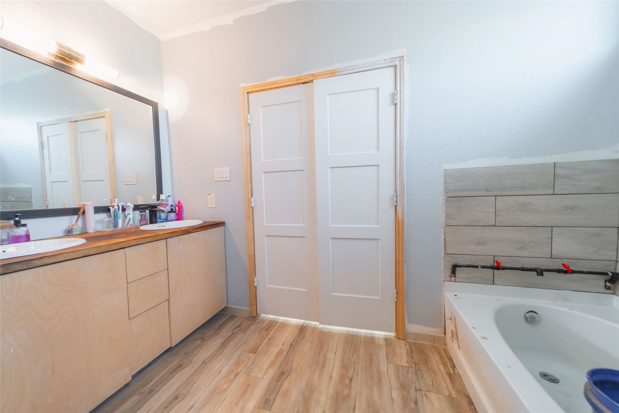 11 Seth Cleveland, TX 77328 - Photo 9 of 50 a bathroom with a tub sink and mirror