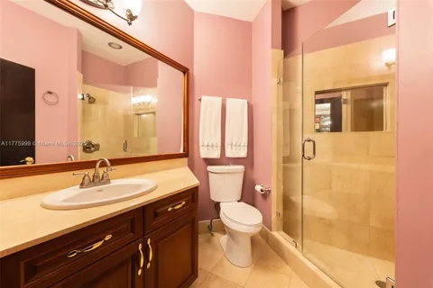 a bathroom with a sink toilet and mirror