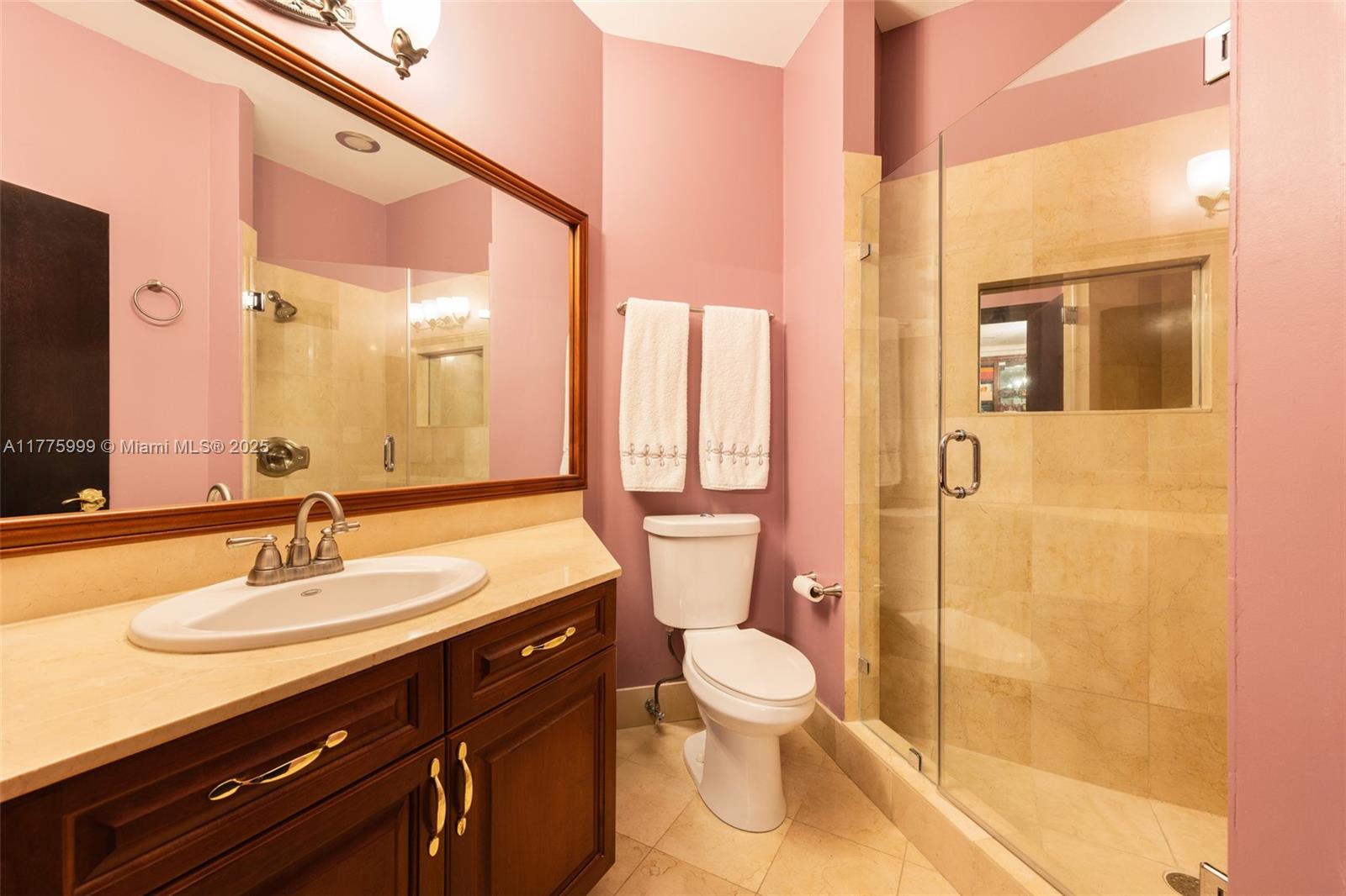 3707 Northeast 214th Street, Unit 14 Aventura, FL 33180 - Photo 22 of 47 a bathroom with a sink a toilet and shower