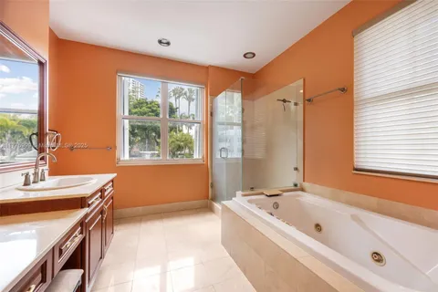 a bathroom with a toilet a sink and a mirror