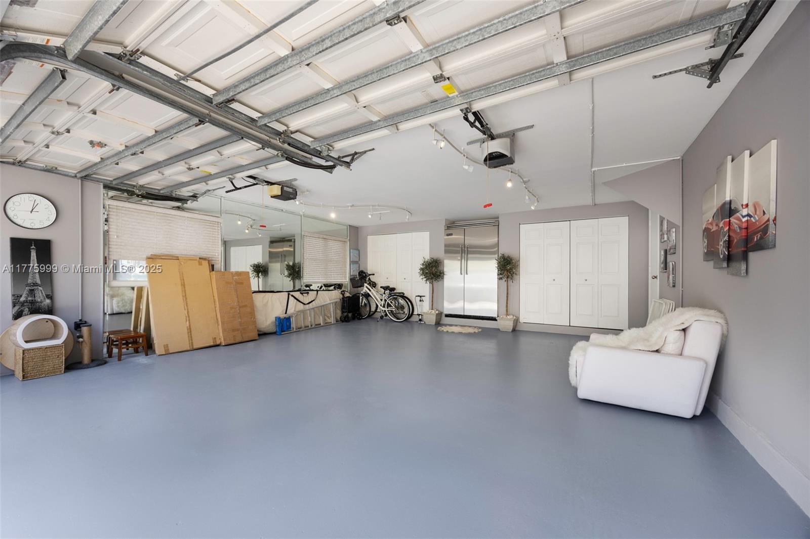 3707 Northeast 214th Street, Unit 14 Aventura, FL 33180 - Photo 29 of 47 a view of a livingroom with furniture and a ceiling fan
