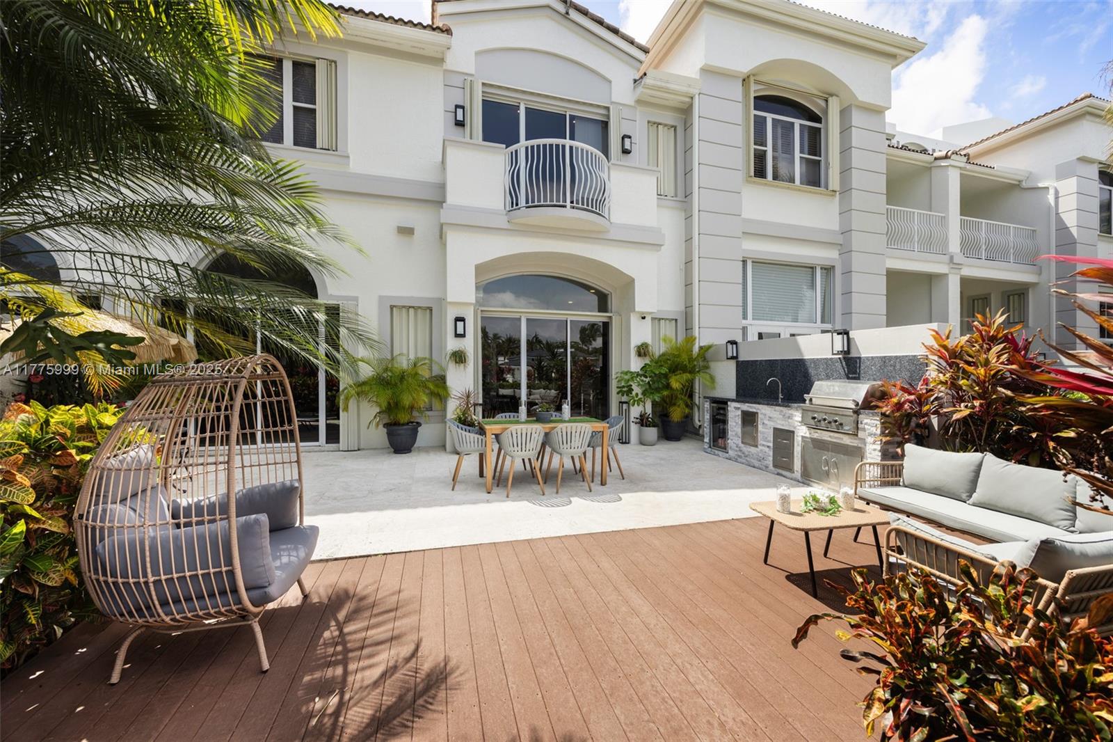 3707 Northeast 214th Street, Unit 14 Aventura, FL 33180 - Photo 32 of 47 a view of a building with patio outdoor seating