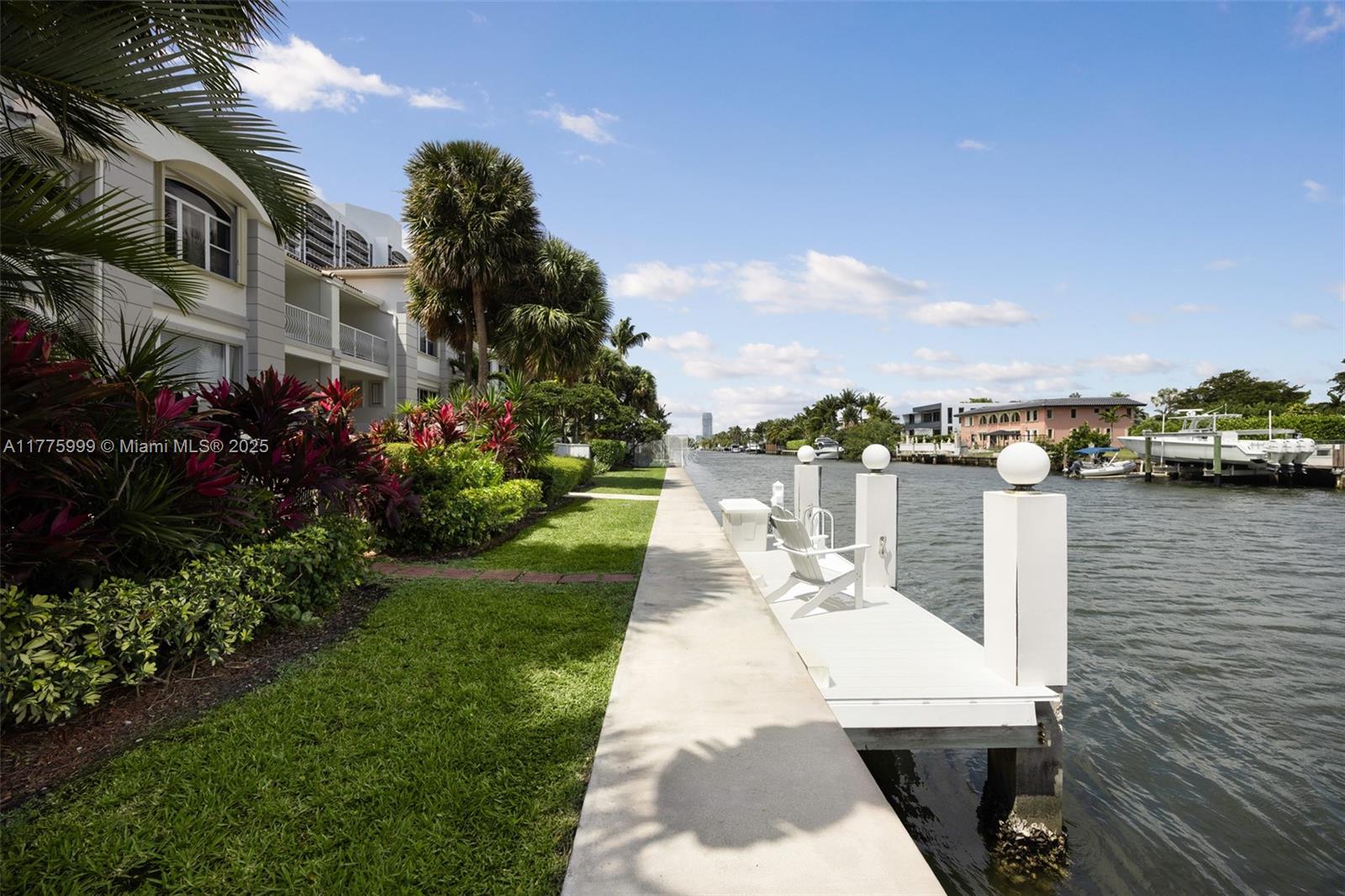 3707 Northeast 214th Street, Unit 14 Aventura, FL 33180 - Photo 35 of 47 a view of a lake with couches and city view
