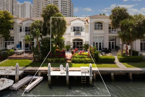 an aerial view of a house with a lake view