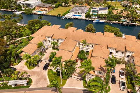 an aerial view of a house with a lake view