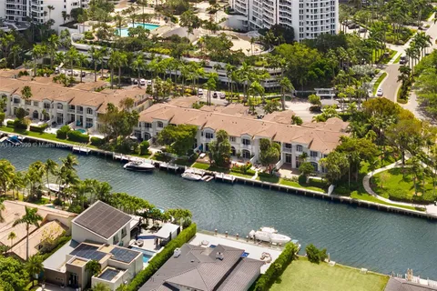 an aerial view of a house with a lake view