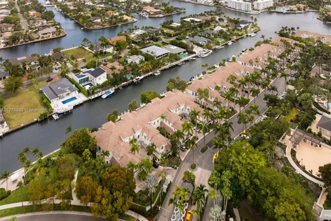 an aerial view of a house with a lake view