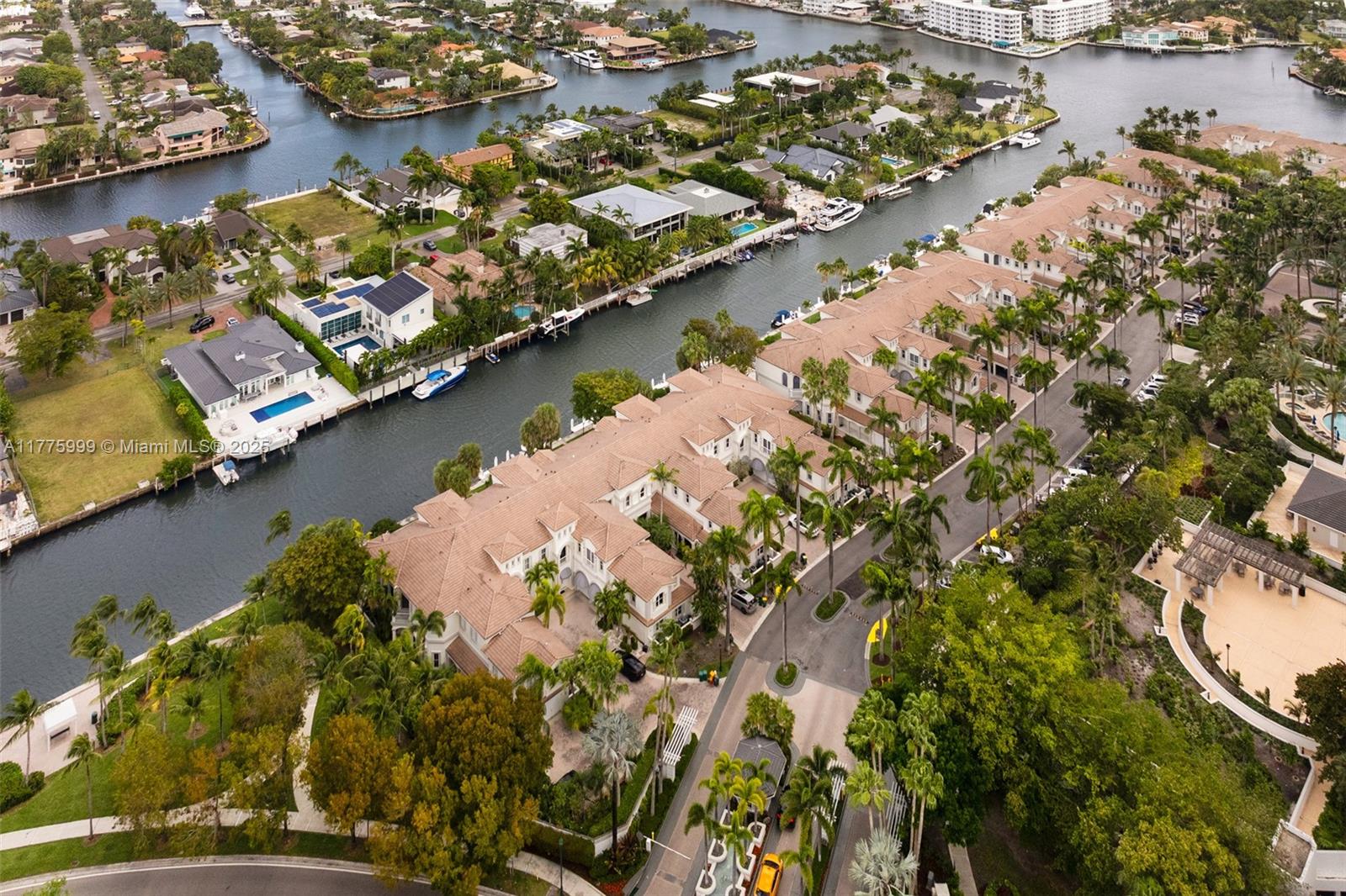 3707 Northeast 214th Street, Unit 14 Aventura, FL 33180 - Photo 44 of 47 an aerial view of residential houses with outdoor space
