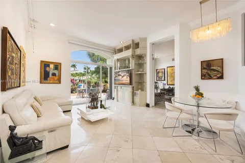 a living room with furniture and a painting