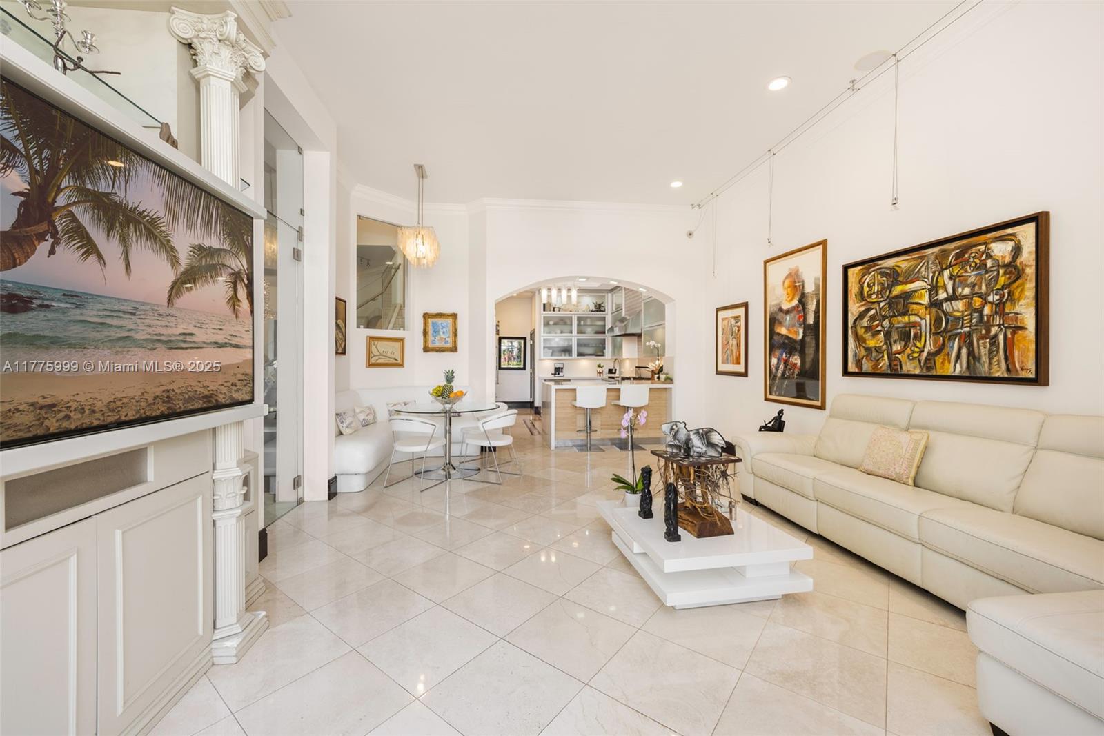 3707 Northeast 214th Street, Unit 14 Aventura, FL 33180 - Photo 9 of 47 a living room with furniture and a painting