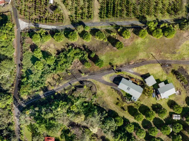 an aerial view of residential house with outdoor space