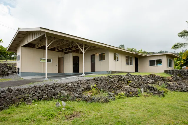 an aerial view of residential house with outdoor space