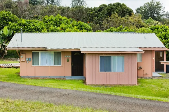 a backyard of a house with lots of green space