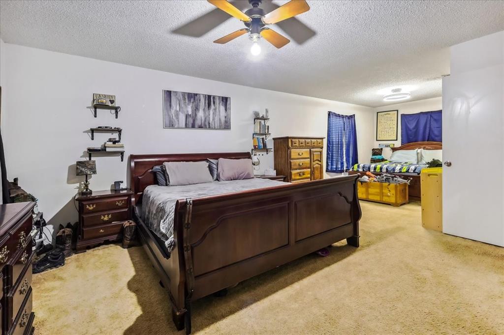 8123 Hilltop Road Argyle, TX 76226 - Photo 21 of 34 a bed room with a bed and furniture