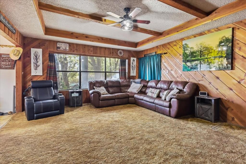 8123 Hilltop Road Argyle, TX 76226 - Photo 26 of 34 a living room with furniture and a large window