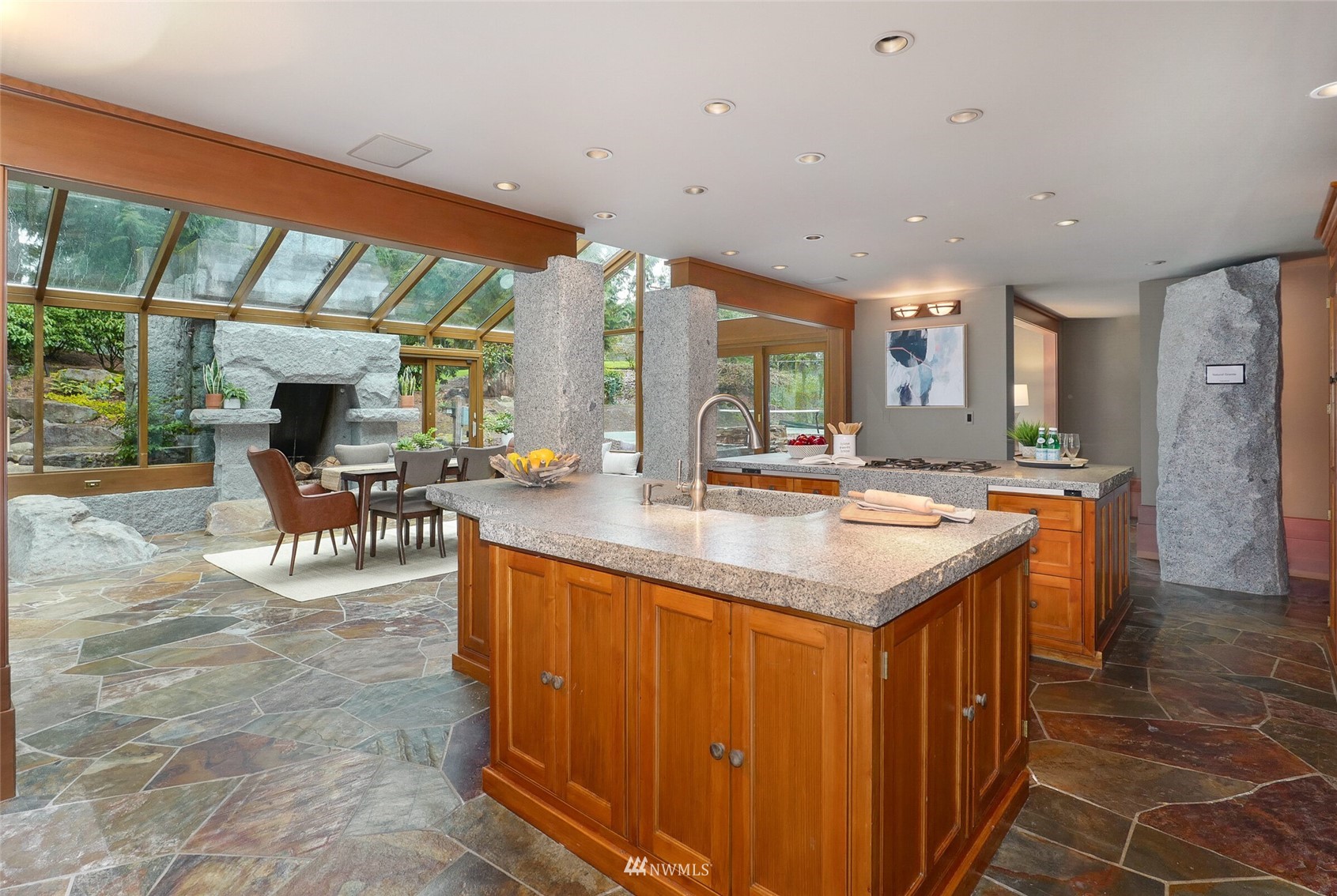 2315 216th Place Northeast Sammamish, WA 98074 - Photo 12 of 38 a kitchen with kitchen island a sink and a large window