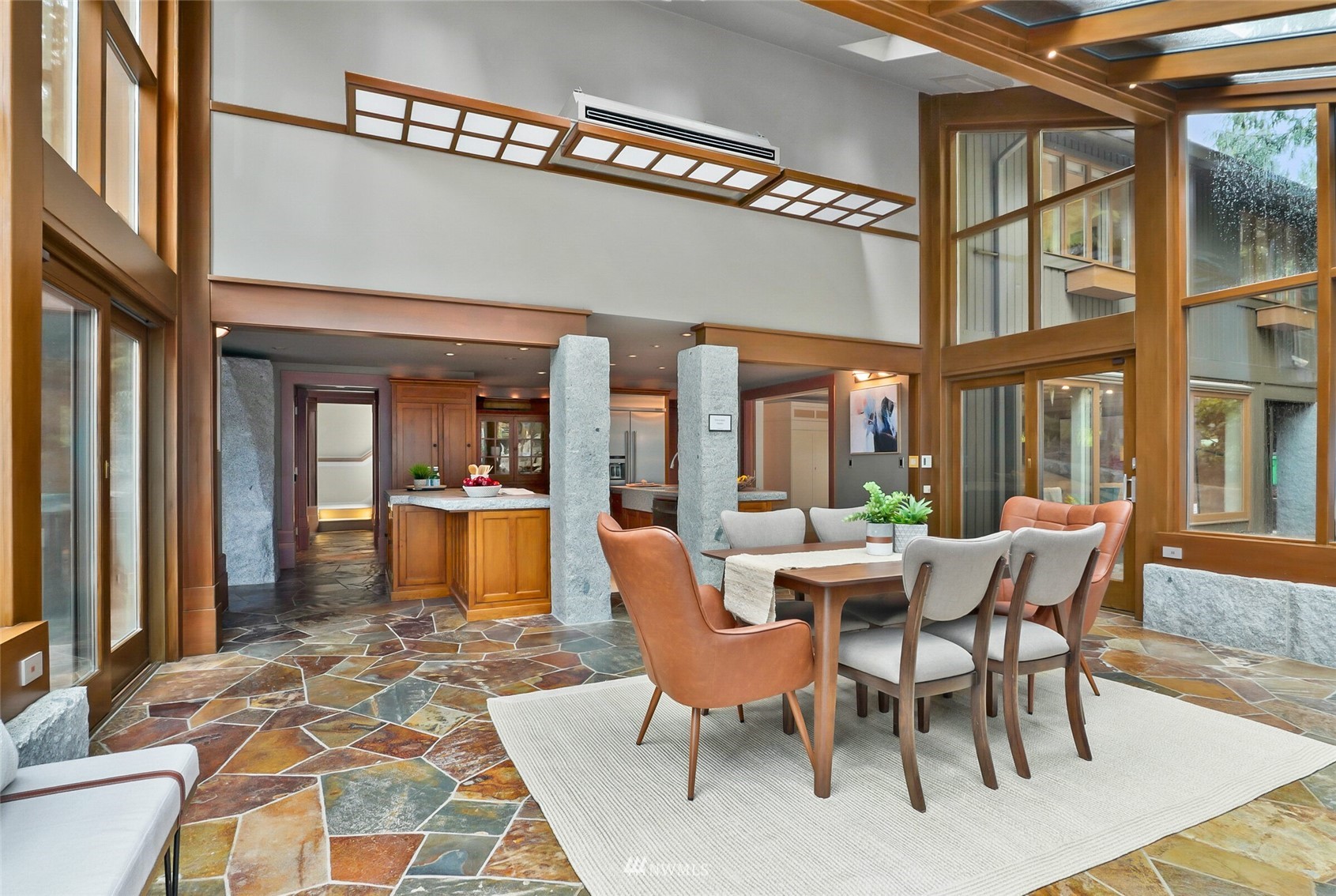 2315 216th Place Northeast Sammamish, WA 98074 - Photo 13 of 38 a view of a patio with dining table and chairs with wooden floor