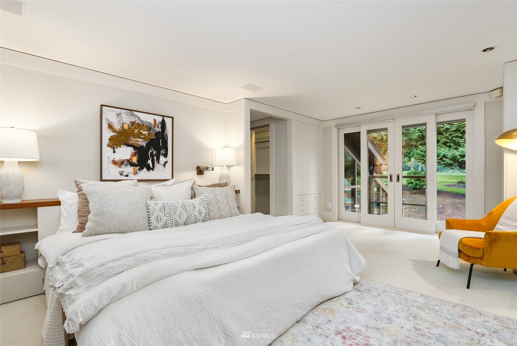 2315 216th Place Northeast Sammamish, WA 98074 - Photo 17 of 38 a bedroom with a large bed and a large window