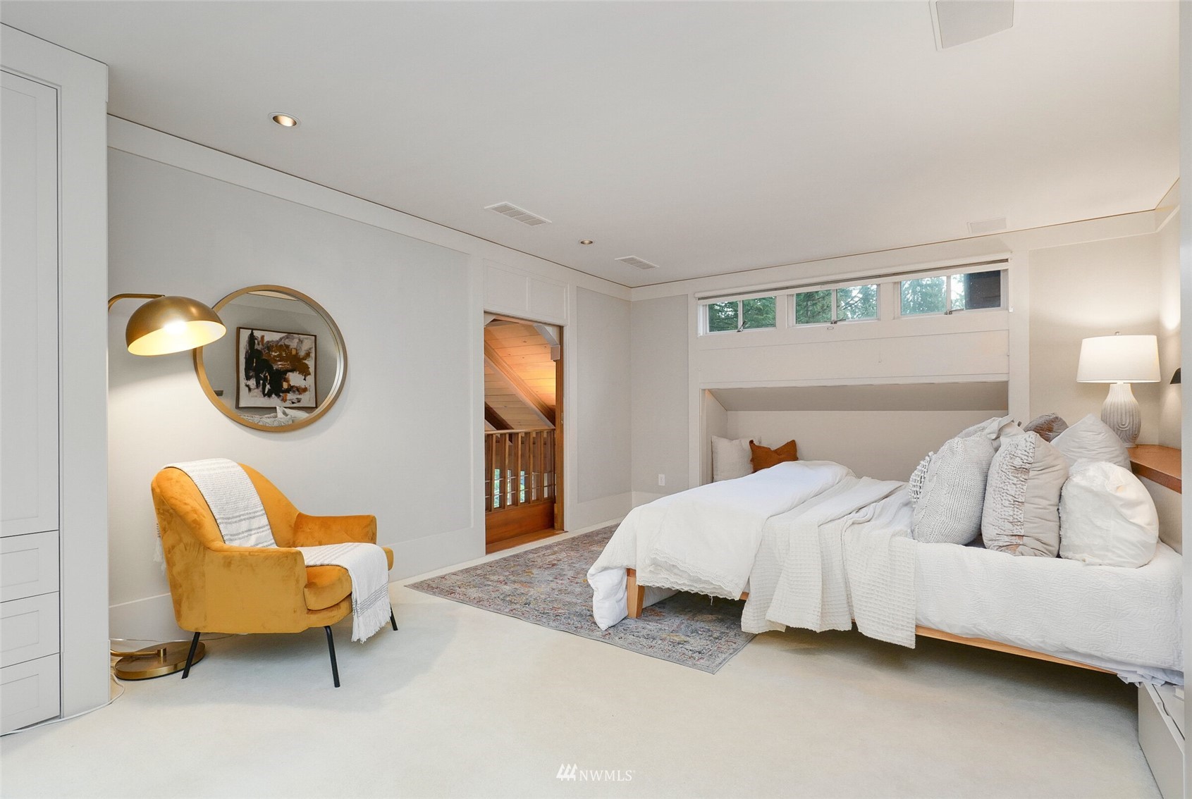 2315 216th Place Northeast Sammamish, WA 98074 - Photo 18 of 38 a bedroom with a bed and a lamp on dresser next to a window