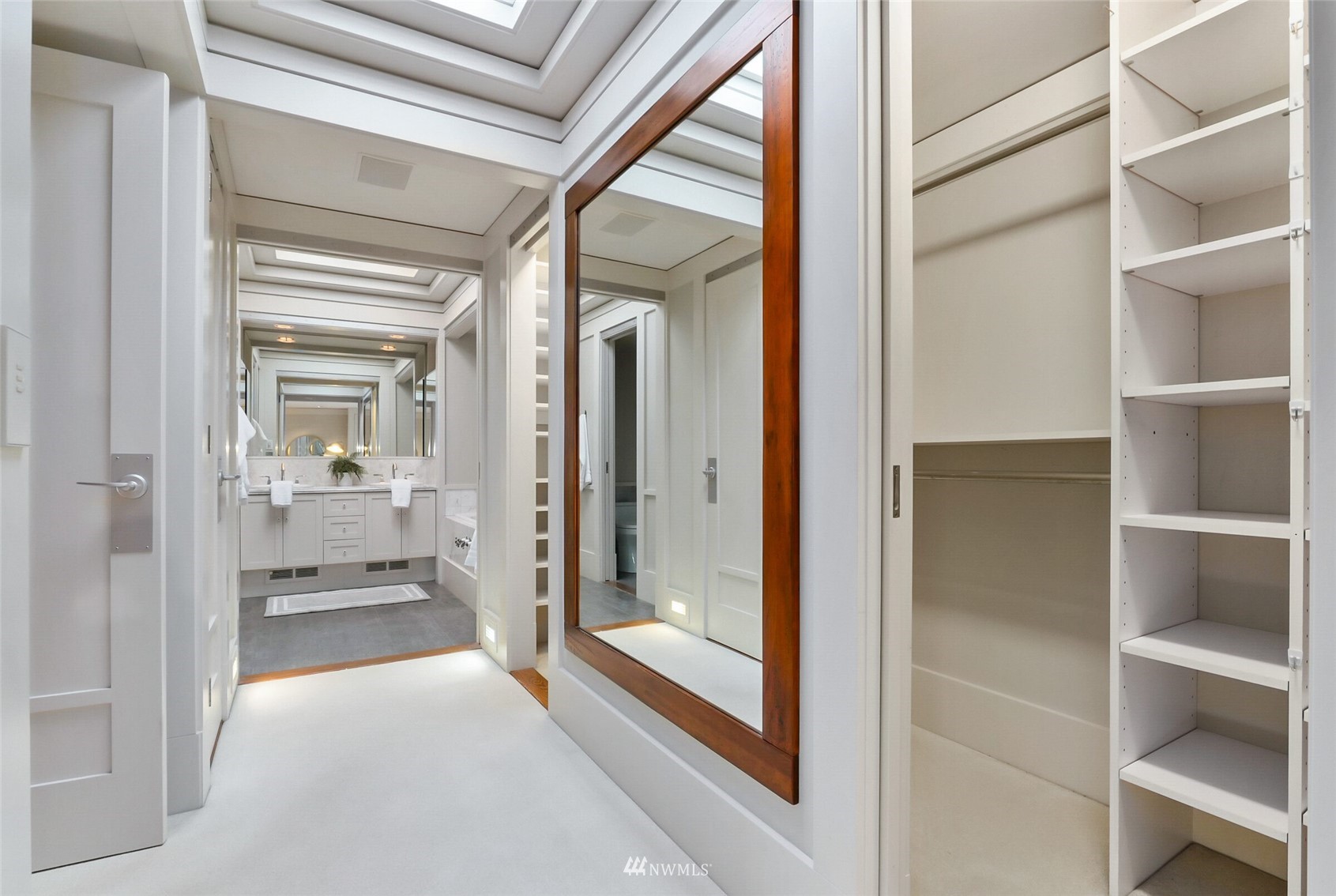2315 216th Place Northeast Sammamish, WA 98074 - Photo 20 of 38 a view of a hallway with wooden floor and windows