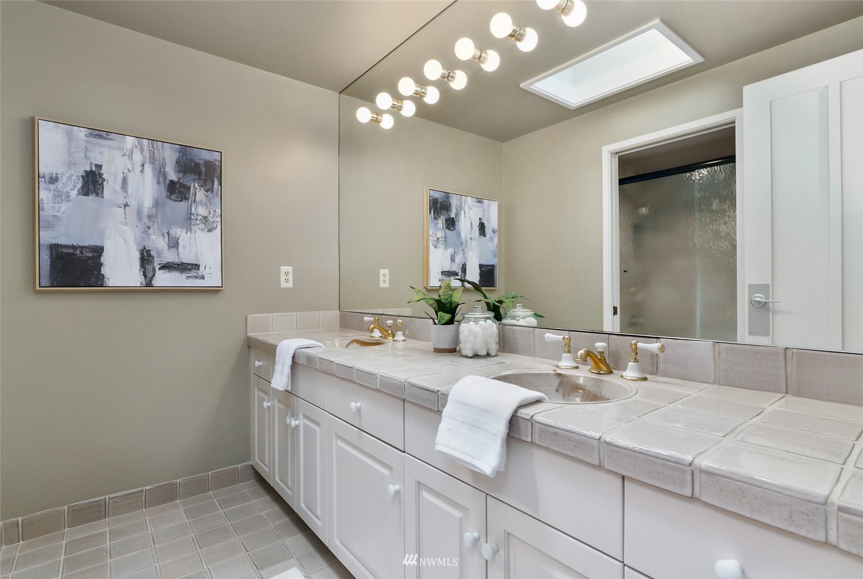 2315 216th Place Northeast Sammamish, WA 98074 - Photo 26 of 38 a bathroom with a sink and a mirror