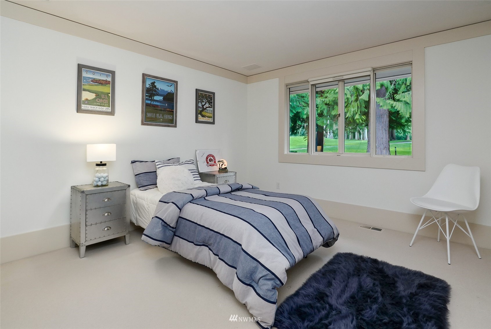 2315 216th Place Northeast Sammamish, WA 98074 - Photo 27 of 38 a bed room with a bed and a chair