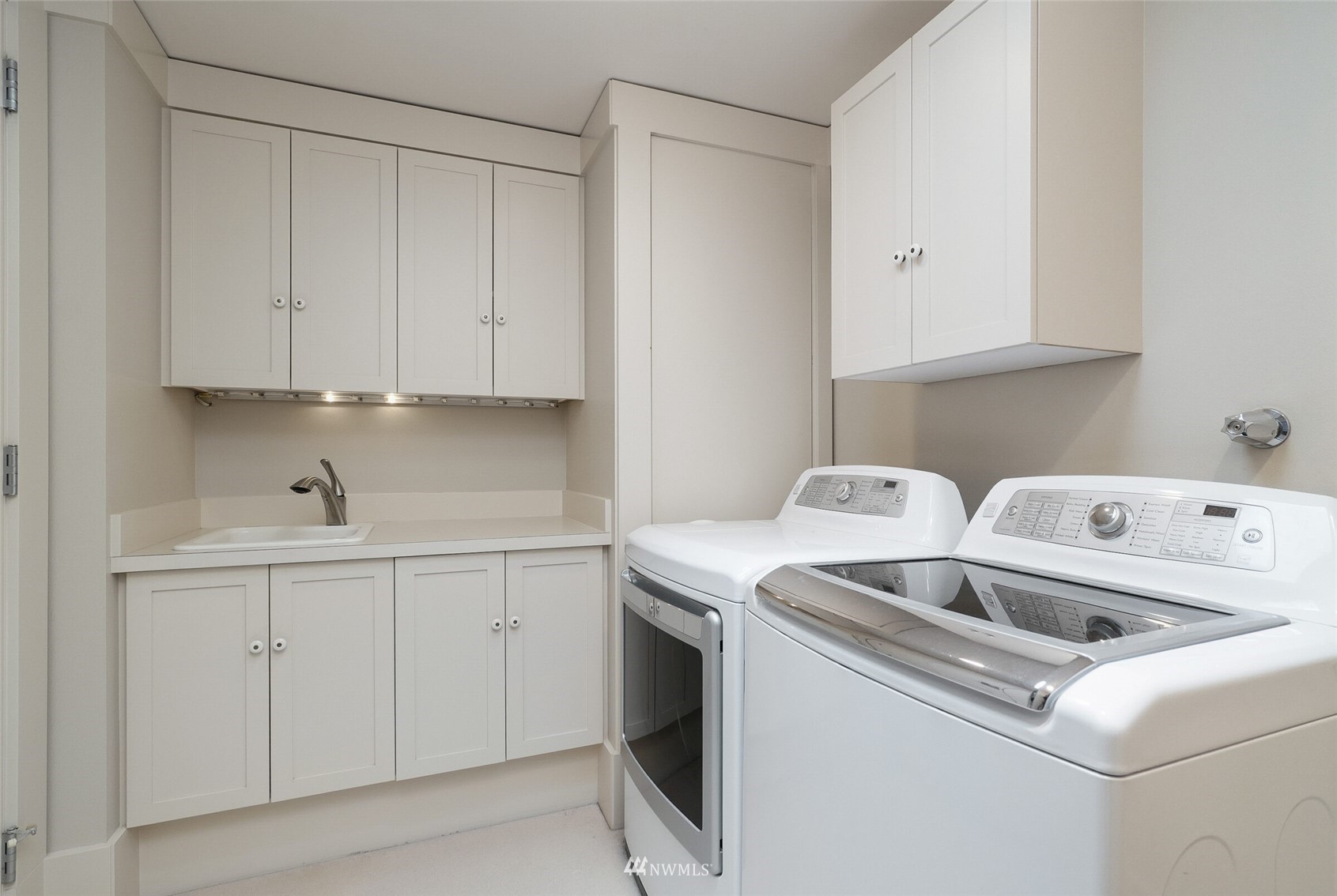2315 216th Place Northeast Sammamish, WA 98074 - Photo 28 of 38 a utility room with sink dryer and washer