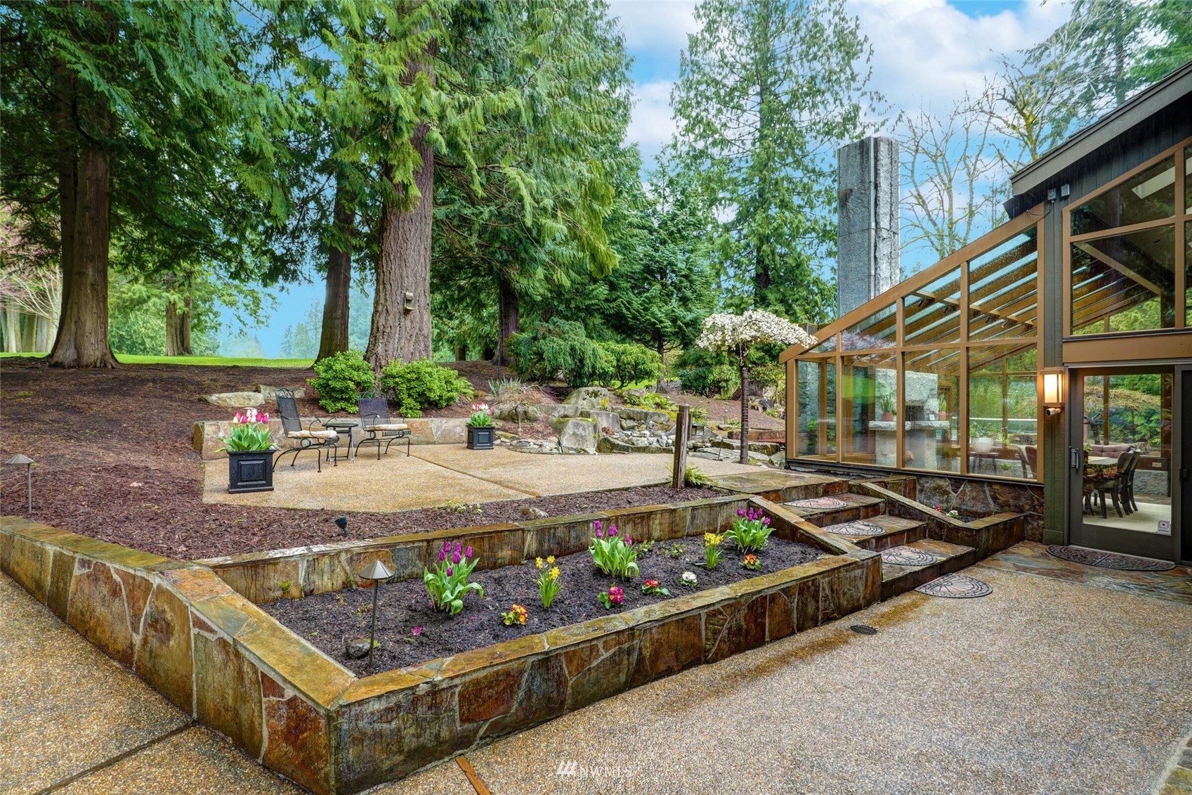 2315 216th Place Northeast Sammamish, WA 98074 - Photo 29 of 38 a view of a two chairs and table in the patio