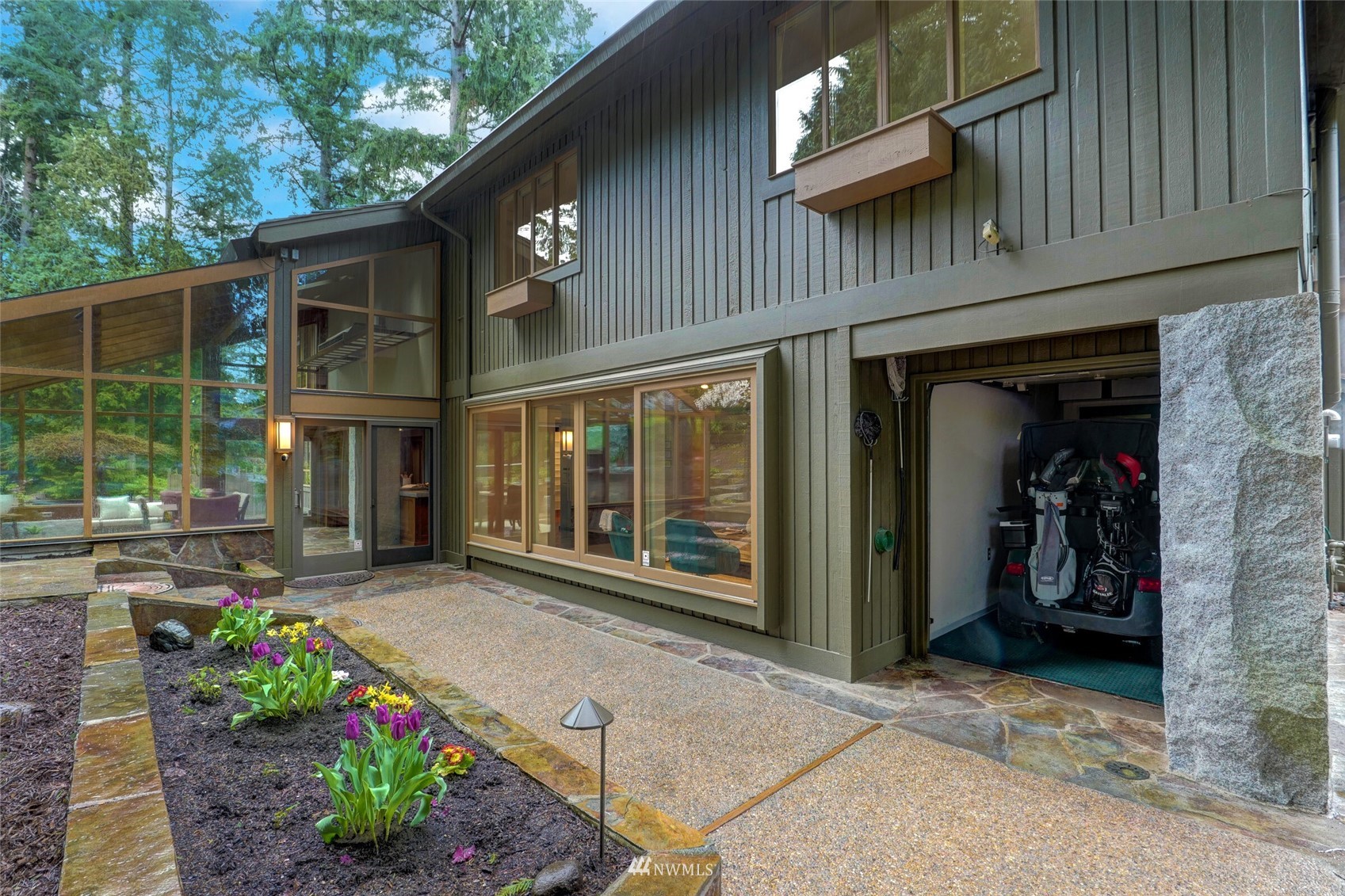 2315 216th Place Northeast Sammamish, WA 98074 - Photo 32 of 38 a view of a house with a potted plant and floor to ceiling window and potted plants