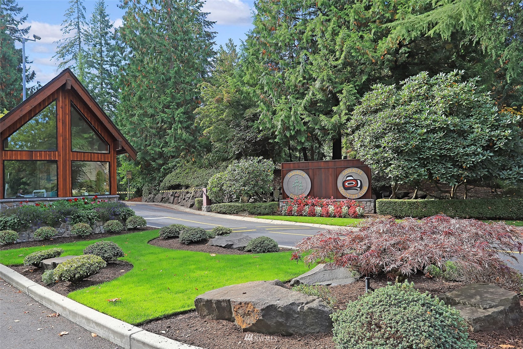 2315 216th Place Northeast Sammamish, WA 98074 - Photo 34 of 38 a view of a wooden house with a yard and large trees