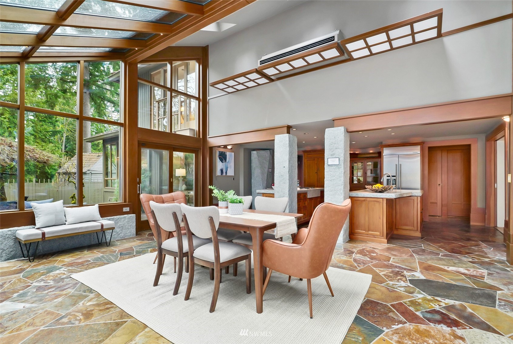 2315 216th Place Northeast Sammamish, WA 98074 - Photo 8 of 38 a dining room with furniture large windows and wooden floor
