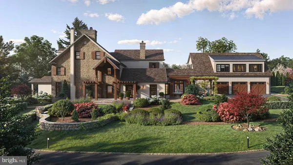 a front view of a house with a yard and potted plants