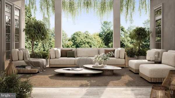 a view of a patio with couches table and chairs and potted plants