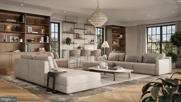 a living room with furniture and a chandelier