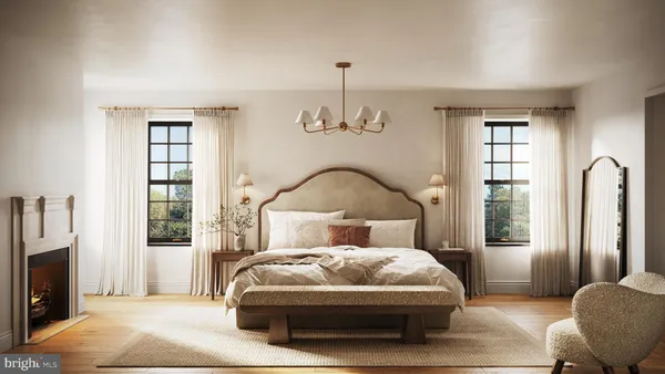 a bedroom with a large bed and a window
