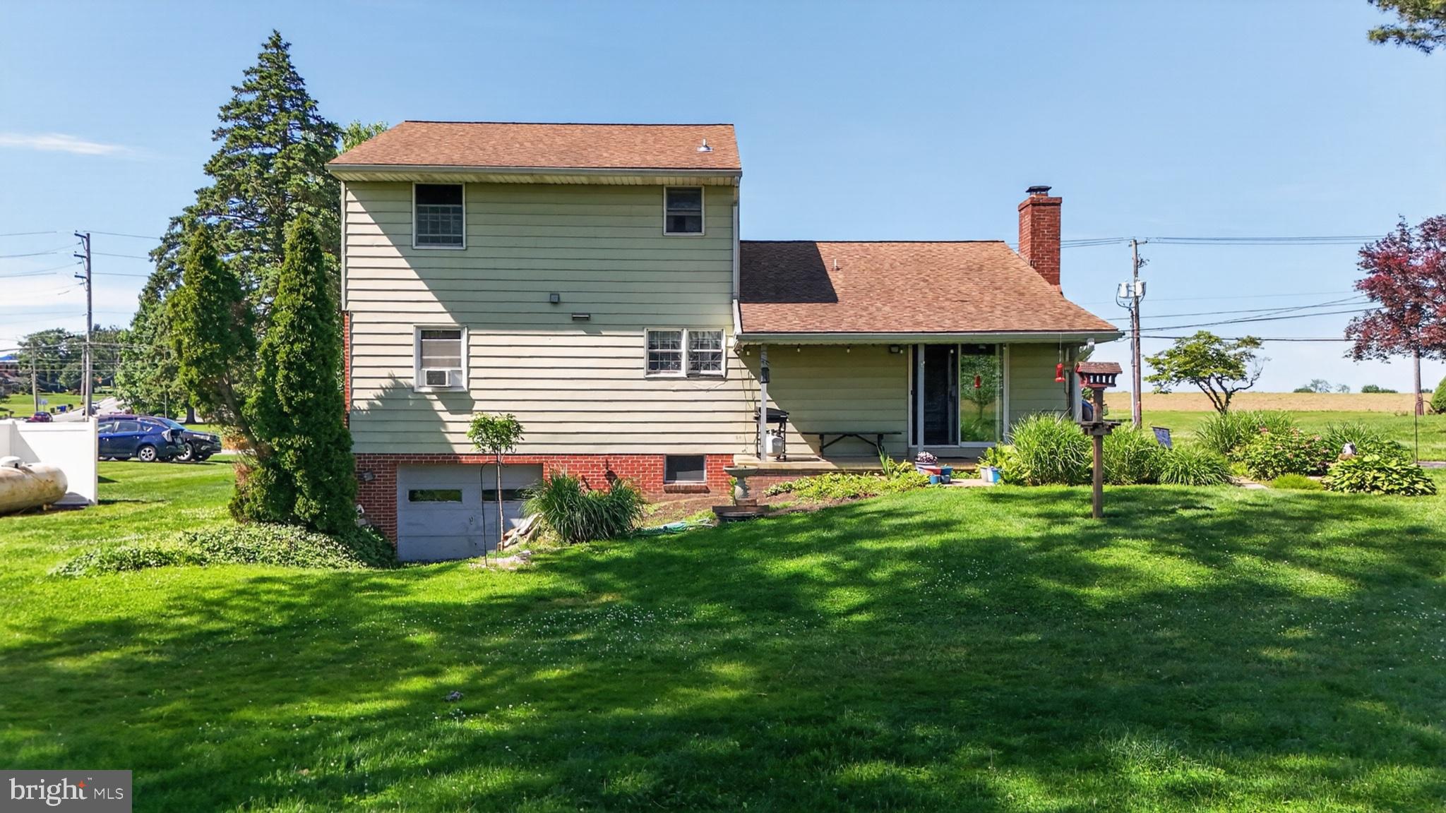 1106 Village Road Lancaster, PA 17602 - Photo 22 of 42 Charming home with lush green surroundings.