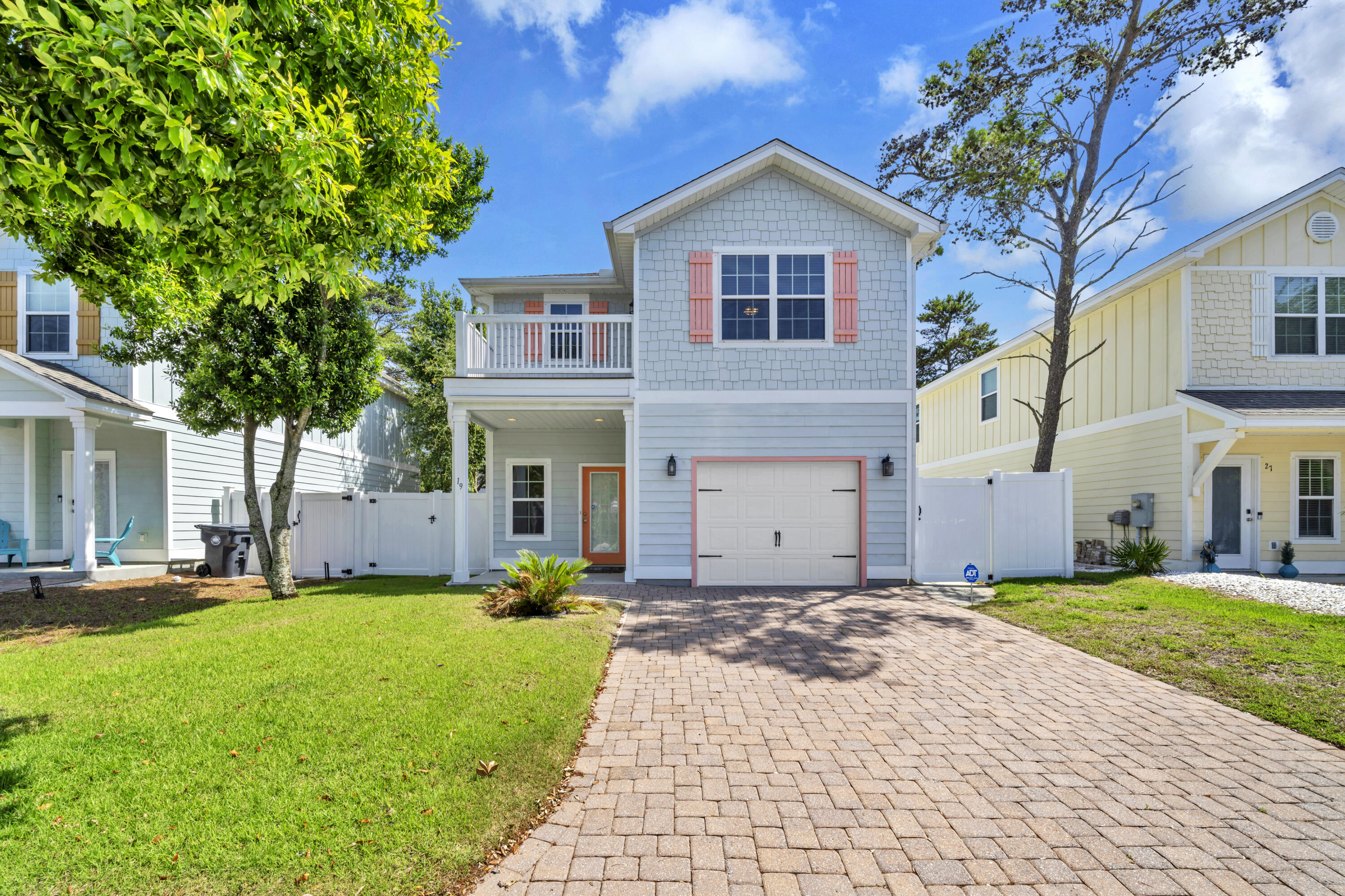 19 Topside Drive Inlet Beach, FL 32461 - Photo 1 of 28 a front view of a house with a yard and garage