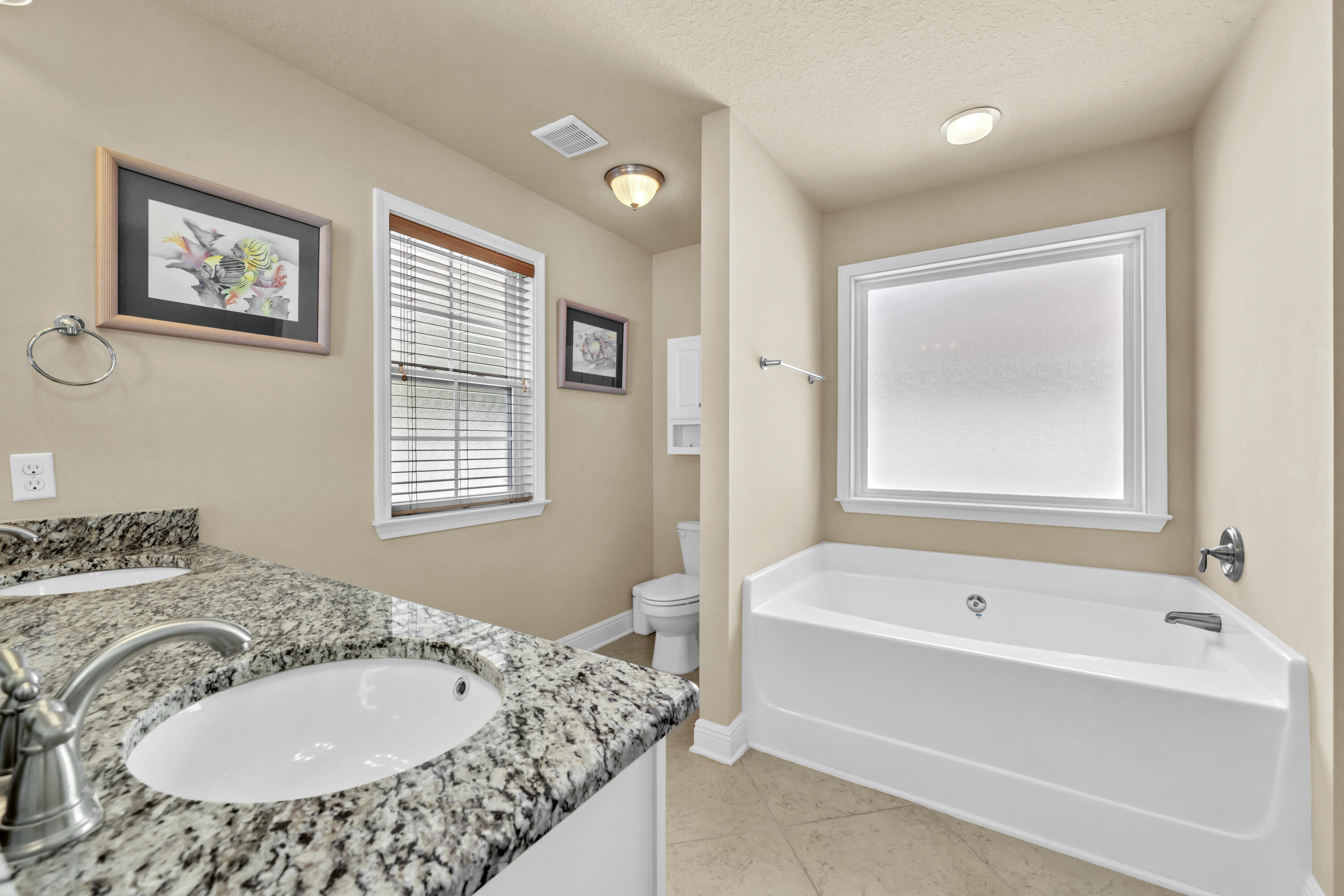 19 Topside Drive Inlet Beach, FL 32461 - Photo 12 of 28 a bathroom with a tub a sink and a window