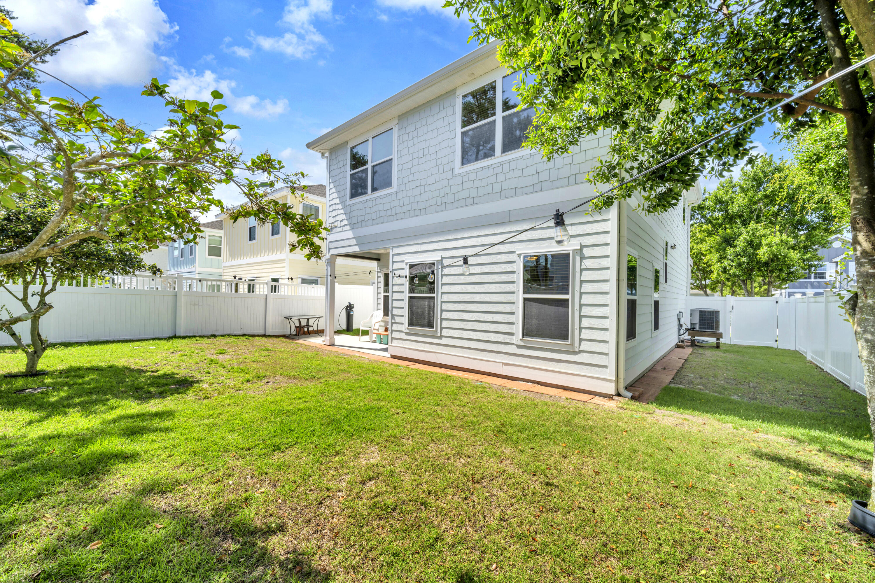 19 Topside Drive Inlet Beach, FL 32461 - Photo 23 of 28 a view of a backyard with plants and a patio