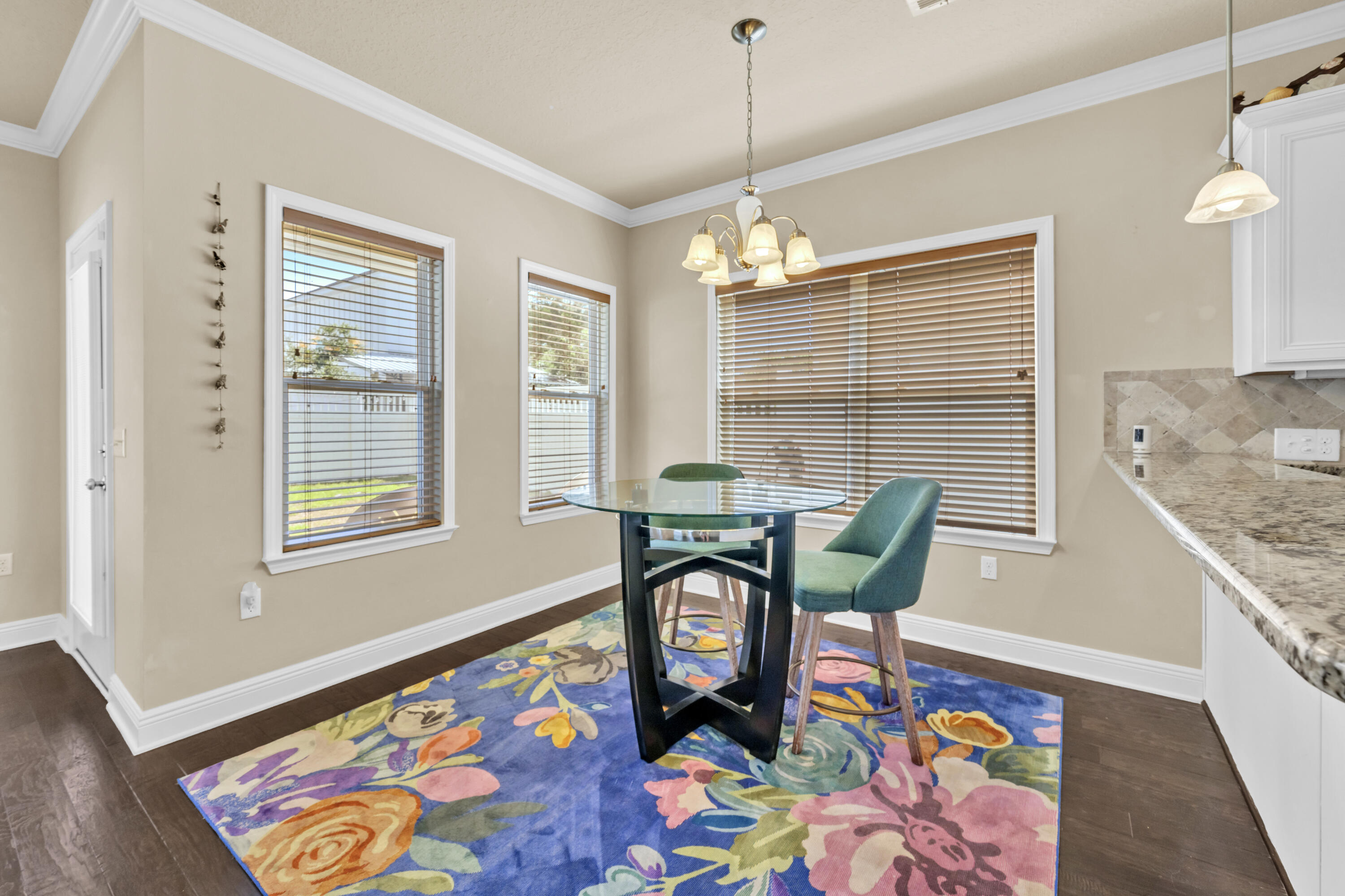 19 Topside Drive Inlet Beach, FL 32461 - Photo 5 of 28 a view of a dining room with furniture and chandelier