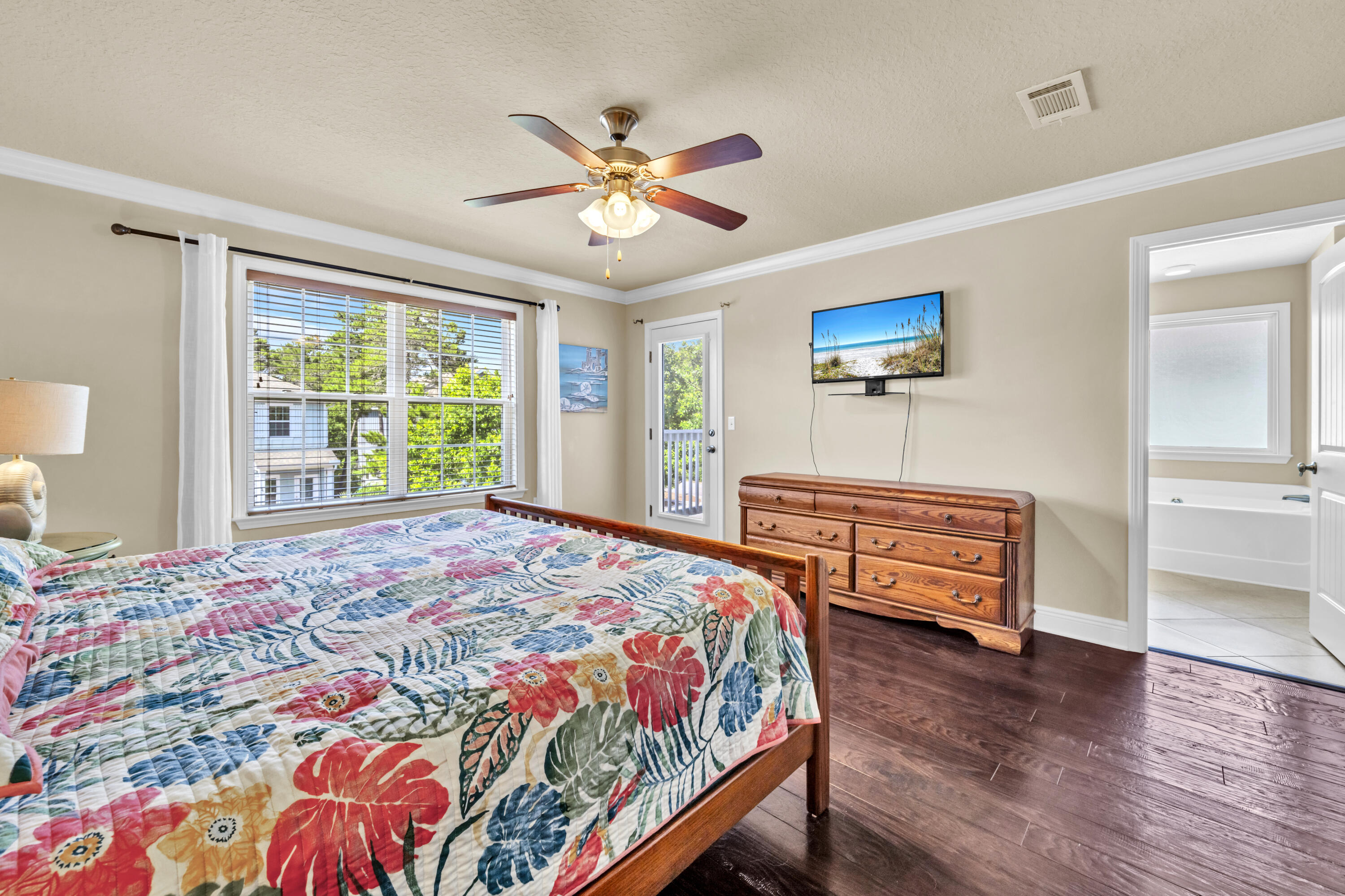 19 Topside Drive Inlet Beach, FL 32461 - Photo 10 of 28 a bedroom with a bed and a chandelier