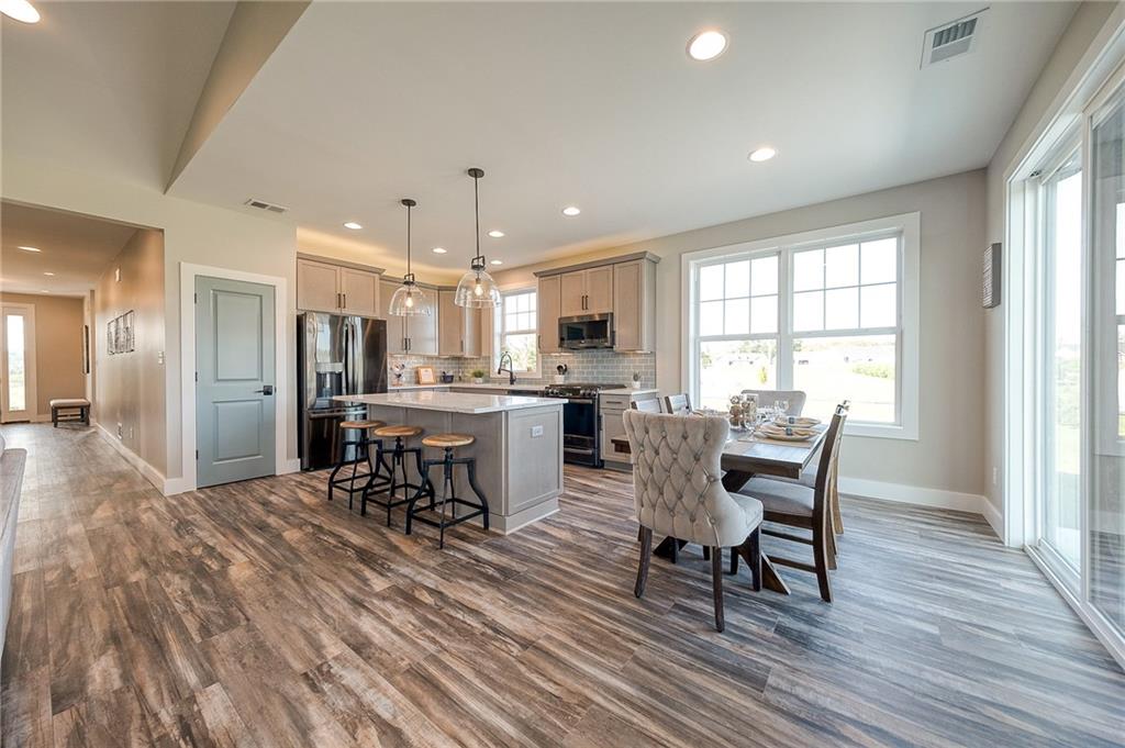 103 Ridge Line Drive Apollo, PA 15613 - Photo 18 of 39 a view of a dining room with furniture window and wooden floor