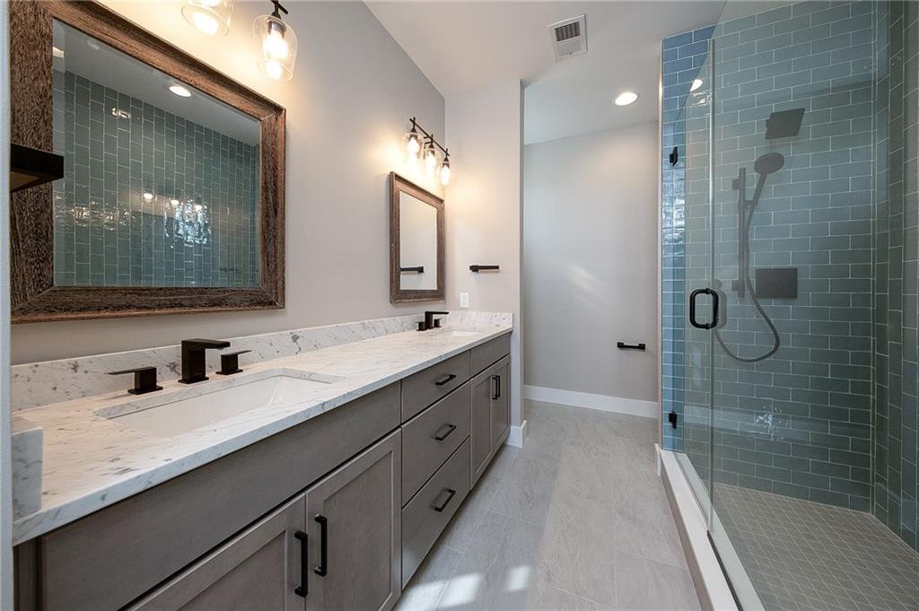 103 Ridge Line Drive Apollo, PA 15613 - Photo 29 of 39 a bathroom with a double vanity sink mirror double and shower
