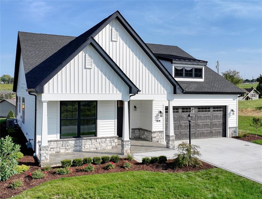 103 Ridge Line Drive Apollo, PA 15613 - Photo 3 of 39 a front view of a house with garden